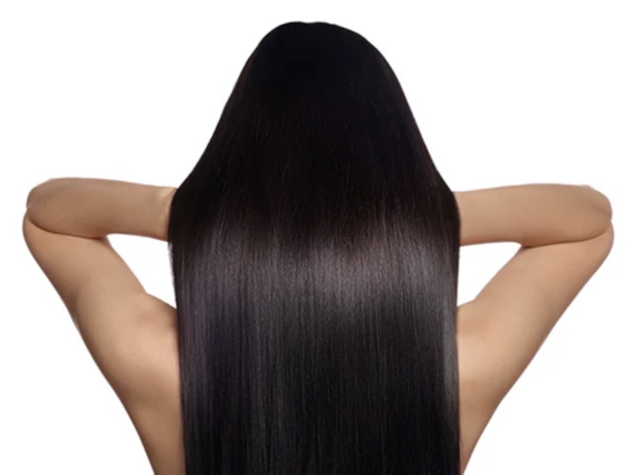 Woman with long healthy hair showing hair restoration results